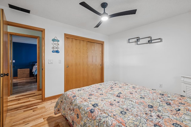 4490 N Bank Rd, Buckeye Lake, OH 43008 - bedroom featuring wood finished floors, a closet, and ceiling fan