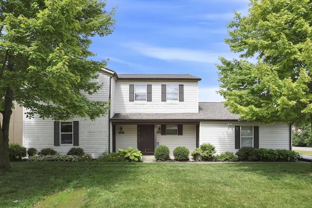 7607-7609 Penwood Pl, Columbus, OH 43235 - traditional-style house featuring a front lawn, covered porch, and roof with shingles