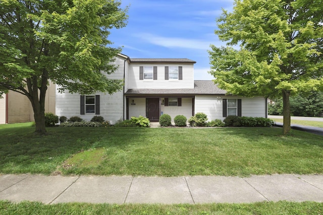 7607-7609 Penwood Pl, Columbus, OH 43235 - traditional-style home with a front yard, a shingled roof, and covered porch