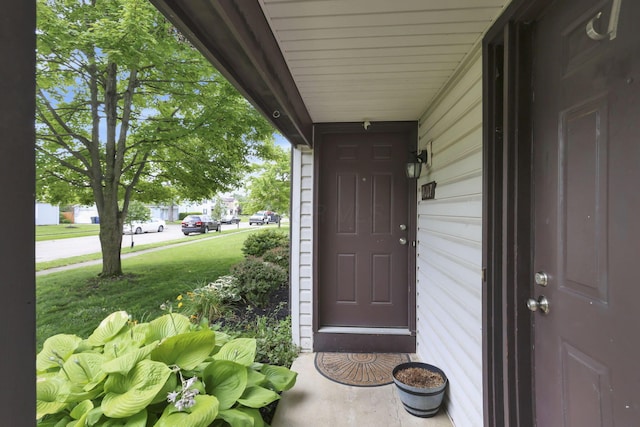 7607-7609 Penwood Pl, Columbus, OH 43235 - entrance to property with covered porch and a yard