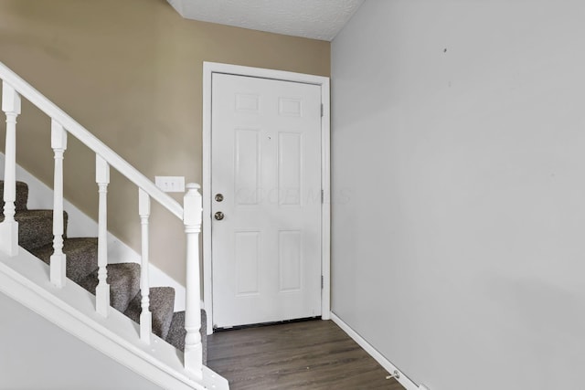 7607-7609 Penwood Pl, Columbus, OH 43235 - foyer with dark wood finished floors and stairway
