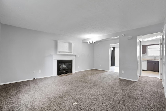 7607-7609 Penwood Pl, Columbus, OH 43235 - unfurnished living room featuring carpet flooring, a fireplace with flush hearth, and a chandelier