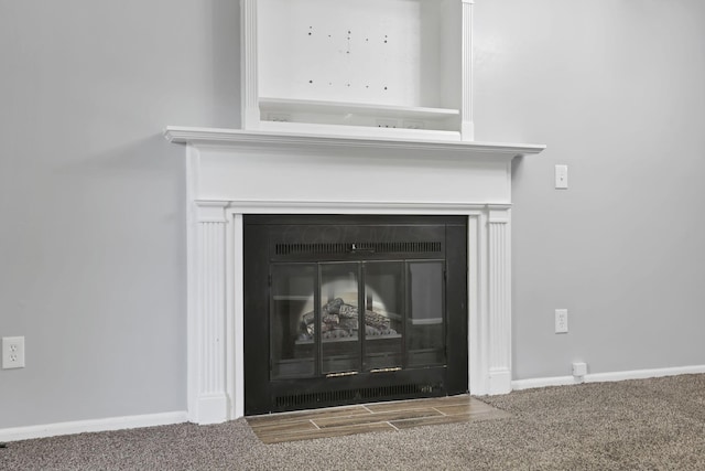 7607-7609 Penwood Pl, Columbus, OH 43235 - detailed view of a glass covered fireplace and carpet floors