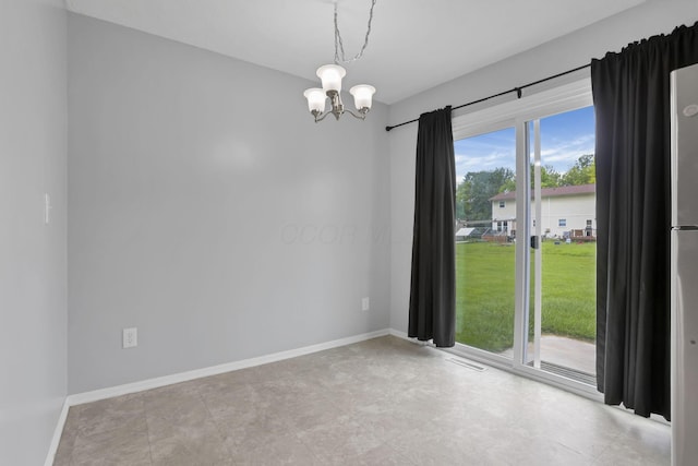 7607-7609 Penwood Pl, Columbus, OH 43235 - spare room with a chandelier and baseboards
