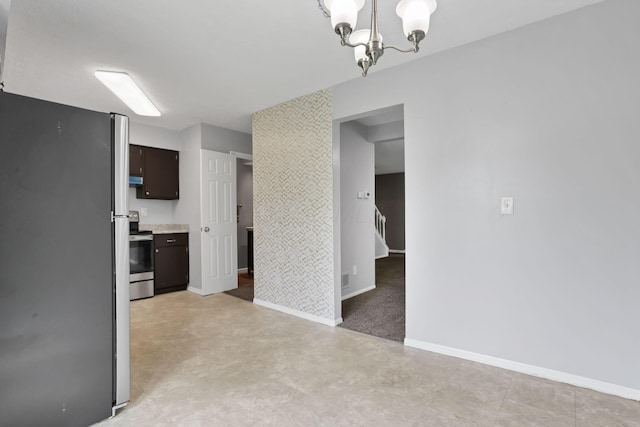7607-7609 Penwood Pl, Columbus, OH 43235 - kitchen with stainless steel appliances, a chandelier, light countertops, dark brown cabinetry, and pendant lighting