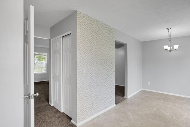 7607-7609 Penwood Pl, Columbus, OH 43235 - hall with a chandelier and baseboards
