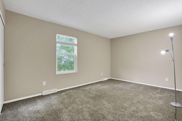 7607-7609 Penwood Pl, Columbus, OH 43235 - carpeted spare room with baseboards and a textured ceiling