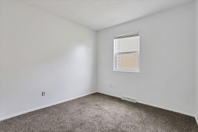 7607-7609 Penwood Pl, Columbus, OH 43235 - carpeted empty room featuring baseboards