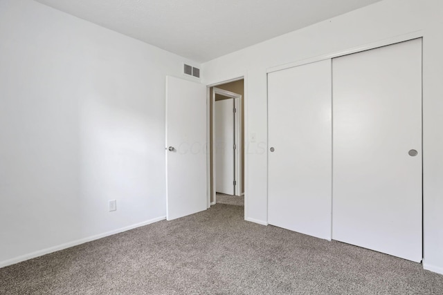 7607-7609 Penwood Pl, Columbus, OH 43235 - unfurnished bedroom featuring carpet flooring and a closet