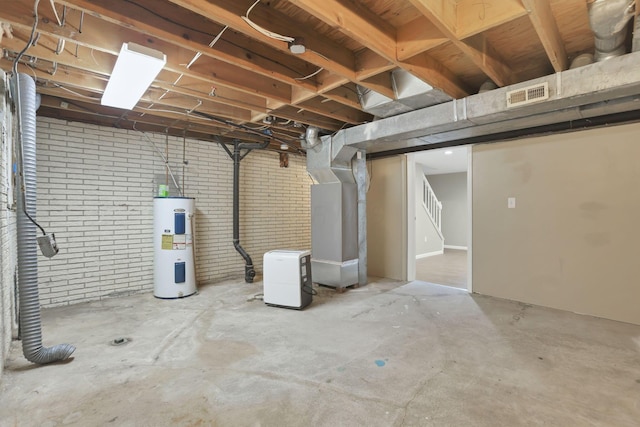 7607-7609 Penwood Pl, Columbus, OH 43235 - unfinished basement with water heater, brick wall, and stairway