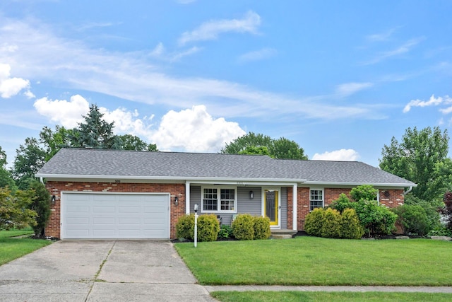 505 Tresham Rd, Columbus, OH 43230 - ranch-style home with concrete driveway, an attached garage, a front yard, a shingled roof, and brick siding
