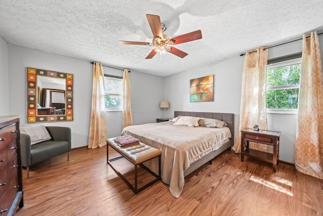 505 Tresham Rd, Columbus, OH 43230 - bedroom featuring wood finished floors, a textured ceiling, and a ceiling fan