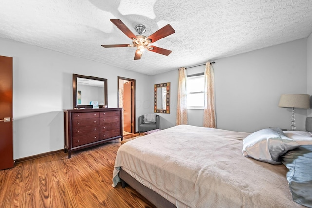 505 Tresham Rd, Columbus, OH 43230 - bedroom with wood finished floors, a textured ceiling, and a ceiling fan