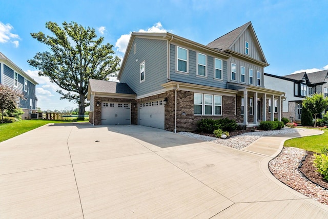 3622 Switchgrass Ct, Hilliard, OH 43026 - craftsman inspired home with brick siding, driveway, an attached garage, and board and batten siding