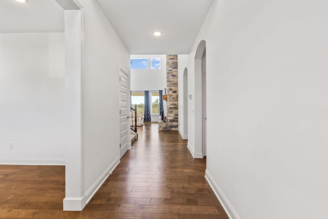 3622 Switchgrass Ct, Hilliard, OH 43026 - hall featuring dark wood-type flooring, arched walkways, and recessed lighting
