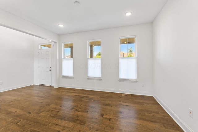 3622 Switchgrass Ct, Hilliard, OH 43026 - empty room featuring plenty of natural light, dark wood finished floors, and recessed lighting