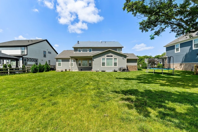3622 Switchgrass Ct, Hilliard, OH 43026 - rear view of house featuring a trampoline