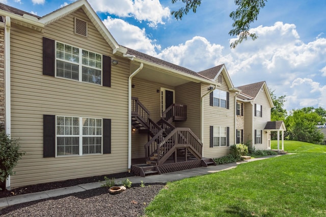 7831 Meadowhaven Blvd Unit 73, Columbus, OH 43235 - rear view of property featuring a yard and stairs