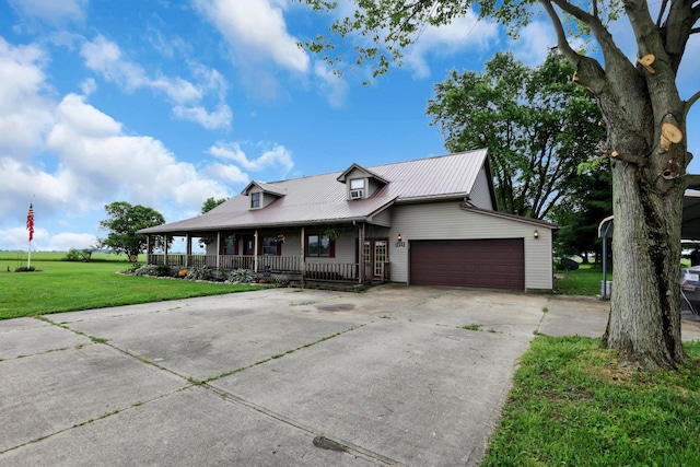 5255 State Route 138, Circleville, OH 43113 - view of front of property featuring a porch, a front yard, a garage, concrete driveway, and a metal roof
