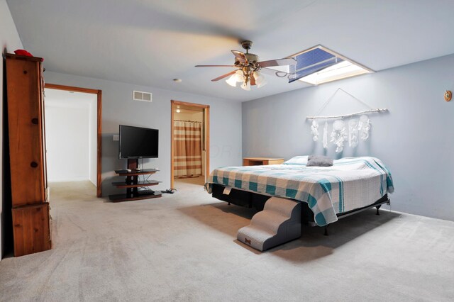 5255 State Route 138, Circleville, OH 43113 - carpeted bedroom with ceiling fan, ensuite bathroom, and a skylight