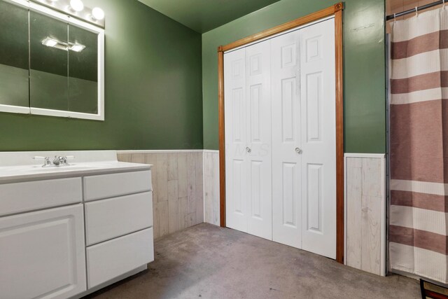 5255 State Route 138, Circleville, OH 43113 - bathroom with wainscoting, vanity, a closet, and a shower with shower curtain