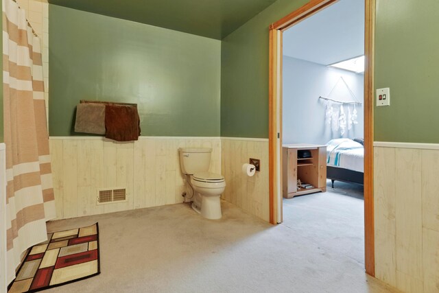 5255 State Route 138, Circleville, OH 43113 - full bathroom with a wainscoted wall, wood walls, and curtained shower