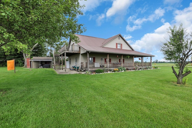 5255 State Route 138, Circleville, OH 43113 - rear view of house with a yard, a metal roof, and covered porch