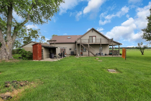 5255 State Route 138, Circleville, OH 43113 - back of property featuring stairs, a wooden deck, a lawn, and a patio