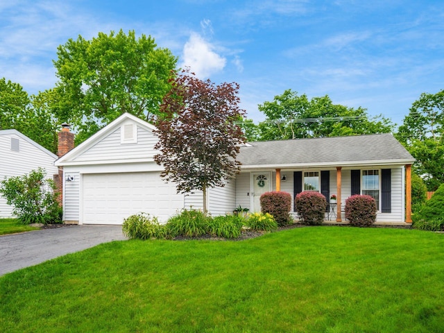 5611 Donnally Ct, Dublin, OH 43016 - ranch-style home featuring asphalt driveway, an attached garage, a front yard, and covered porch