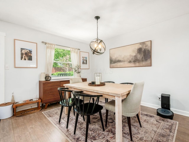 5611 Donnally Ct, Dublin, OH 43016 - dining space featuring light wood-style flooring and a chandelier