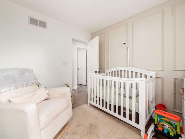 5611 Donnally Ct, Dublin, OH 43016 - bedroom with a nursery area and wood finished floors