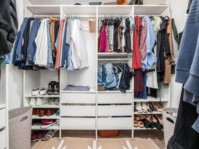 5611 Donnally Ct, Dublin, OH 43016 - walk in closet featuring wood finished floors