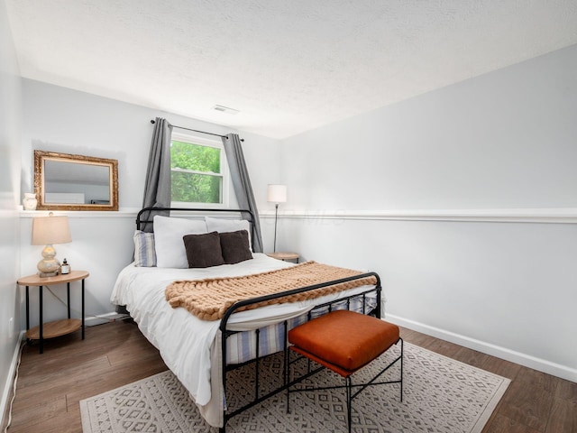 5611 Donnally Ct, Dublin, OH 43016 - bedroom with wood finished floors and a textured ceiling