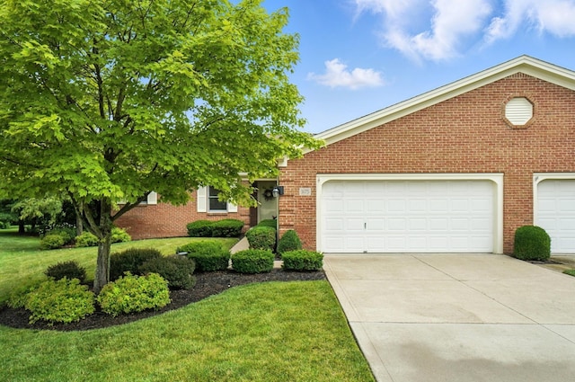 3175 Dartford Trce, Dublin, OH 43017 - view of property hidden behind natural elements with brick siding, driveway, and a front lawn