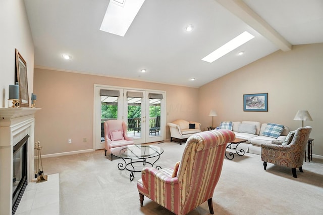 3175 Dartford Trce, Dublin, OH 43017 - living area featuring light colored carpet, a skylight, recessed lighting, a fireplace with flush hearth, and french doors