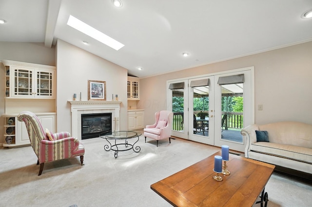 3175 Dartford Trce, Dublin, OH 43017 - living area featuring carpet flooring, a glass covered fireplace, french doors, a skylight, and recessed lighting