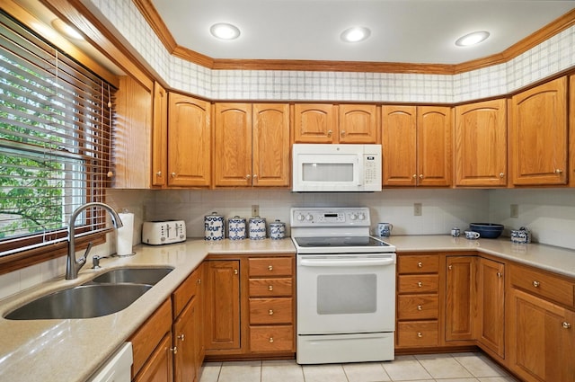 3175 Dartford Trce, Dublin, OH 43017 - kitchen featuring white appliances, brown cabinetry, light countertops, and light tile patterned flooring