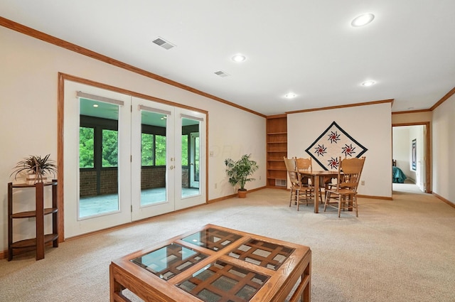 3175 Dartford Trce, Dublin, OH 43017 - living room featuring french doors, light colored carpet, crown molding, and recessed lighting