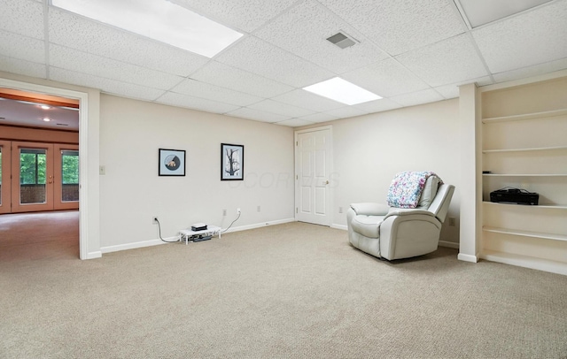 3175 Dartford Trce, Dublin, OH 43017 - unfurnished room featuring carpet floors, a drop ceiling, built in shelves, and french doors