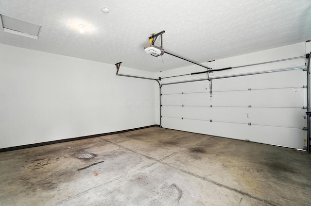 3175 Dartford Trce, Dublin, OH 43017 - garage featuring a garage door opener and baseboards