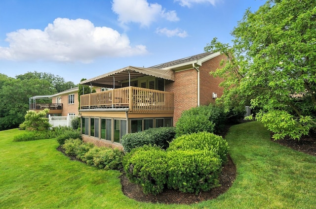 3175 Dartford Trce, Dublin, OH 43017 - rear view of house featuring a balcony, a yard, and brick siding