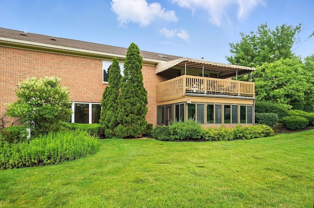 3175 Dartford Trce, Dublin, OH 43017 - rear view of property featuring a balcony, a lawn, and brick siding