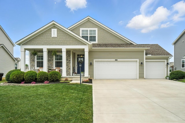 618 Ludham Trl, Pickerington, OH 43147 - craftsman-style home with covered porch, a front yard, a garage, and concrete driveway