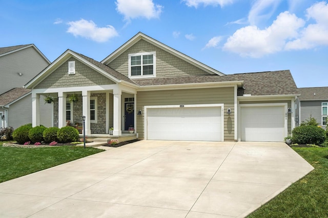 618 Ludham Trl, Pickerington, OH 43147 - craftsman inspired home with covered porch, a garage, concrete driveway, and a front yard