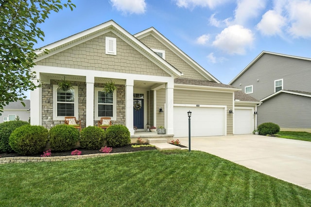 618 Ludham Trl, Pickerington, OH 43147 - craftsman house with a garage, driveway, a porch, and a front lawn