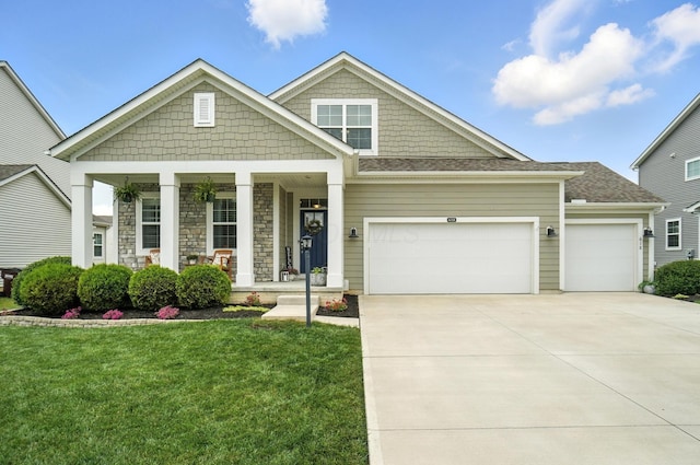618 Ludham Trl, Pickerington, OH 43147 - craftsman inspired home with a porch, an attached garage, a front lawn, and driveway
