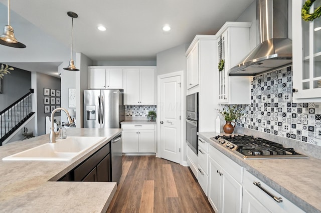 618 Ludham Trl, Pickerington, OH 43147 - kitchen featuring wall chimney range hood, stainless steel appliances, hanging light fixtures, recessed lighting, and glass insert cabinets