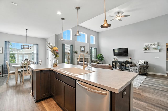 618 Ludham Trl, Pickerington, OH 43147 - kitchen with stainless steel dishwasher, healthy amount of natural light, dark brown cabinetry, light countertops, and recessed lighting