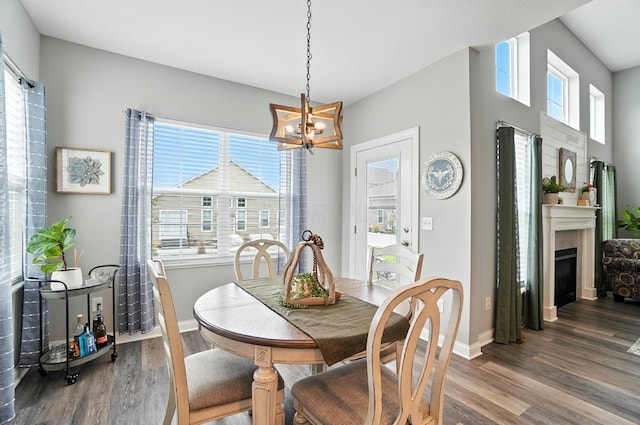 618 Ludham Trl, Pickerington, OH 43147 - dining area with wood finished floors, a chandelier, and a fireplace