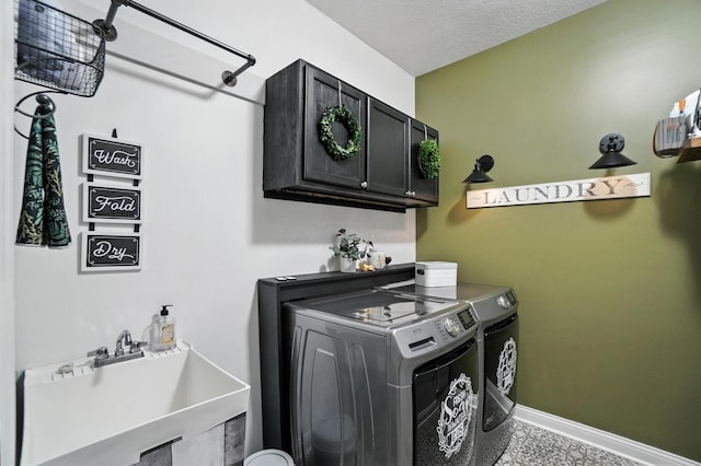 618 Ludham Trl, Pickerington, OH 43147 - laundry room with cabinet space, separate washer and dryer, and a textured ceiling